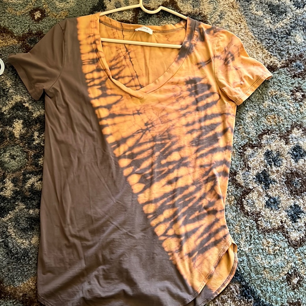 Size large top by Follow me apparel